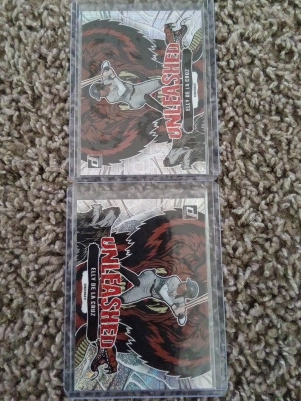 Panini  Elly De La Cruz Unleashed Cards with Red and Black Artwork.